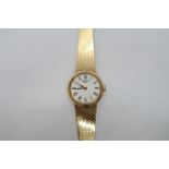 A ladies 9ct hallmarked yellow gold Seiko quartz bracelet watch, round case 22mm, on a 9ct