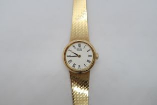 A ladies 9ct hallmarked yellow gold Seiko quartz bracelet watch, round case 22mm, on a 9ct