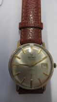 A gents Precimax auto with date and second hand on brown leather strap - working in the saleroom -