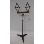 A brass and iron adjustable stand