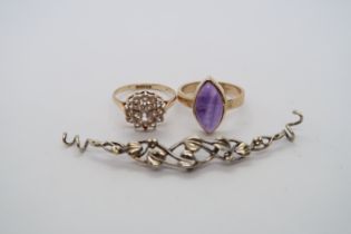 A hallmarked 9ct yellow gold ring with oval cabochon amethyst, size O/P, and another ring size P,