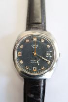 An Oris Gents watch, ticks but stops, on a leather strap
