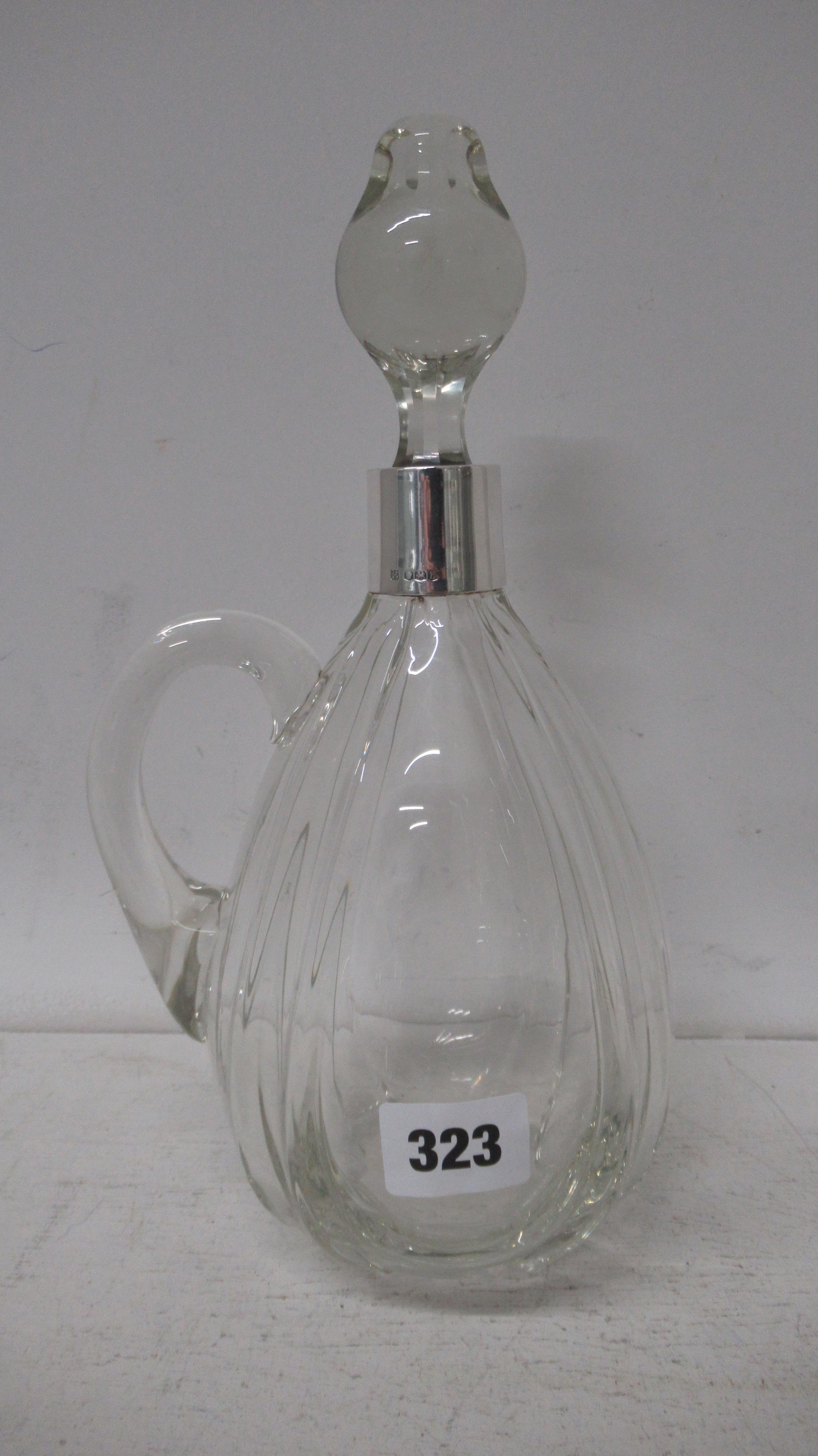 A silver collared claret jug / wine bottle James Deakin & sons, Sheffield 1925, 28cm tall