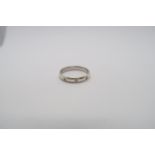 A 9ct white gold three stone diamond band, diamonds are well matched, bright and lively, size S