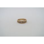 A hallmarked 18ct yellow gold diamond half eternity ring, 12 round brilliant cut diamonds with