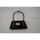 A black onyx and brass pocket watch stand, 12cm x 9cm