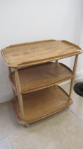 An Ercol blonde two tier tea trolley on wheels - Width 70cm x Height 78cm