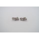 A pair of good quality 18ct white gold diamond Love Knot earrings, colour approx G/H, VS1, head size