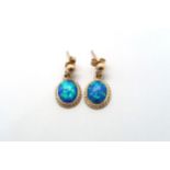 A 9ct yellow gold opal earrings, head size including ball mounts 20mm x 11mm