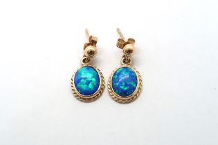 A 9ct yellow gold opal earrings, head size including ball mounts 20mm x 11mm