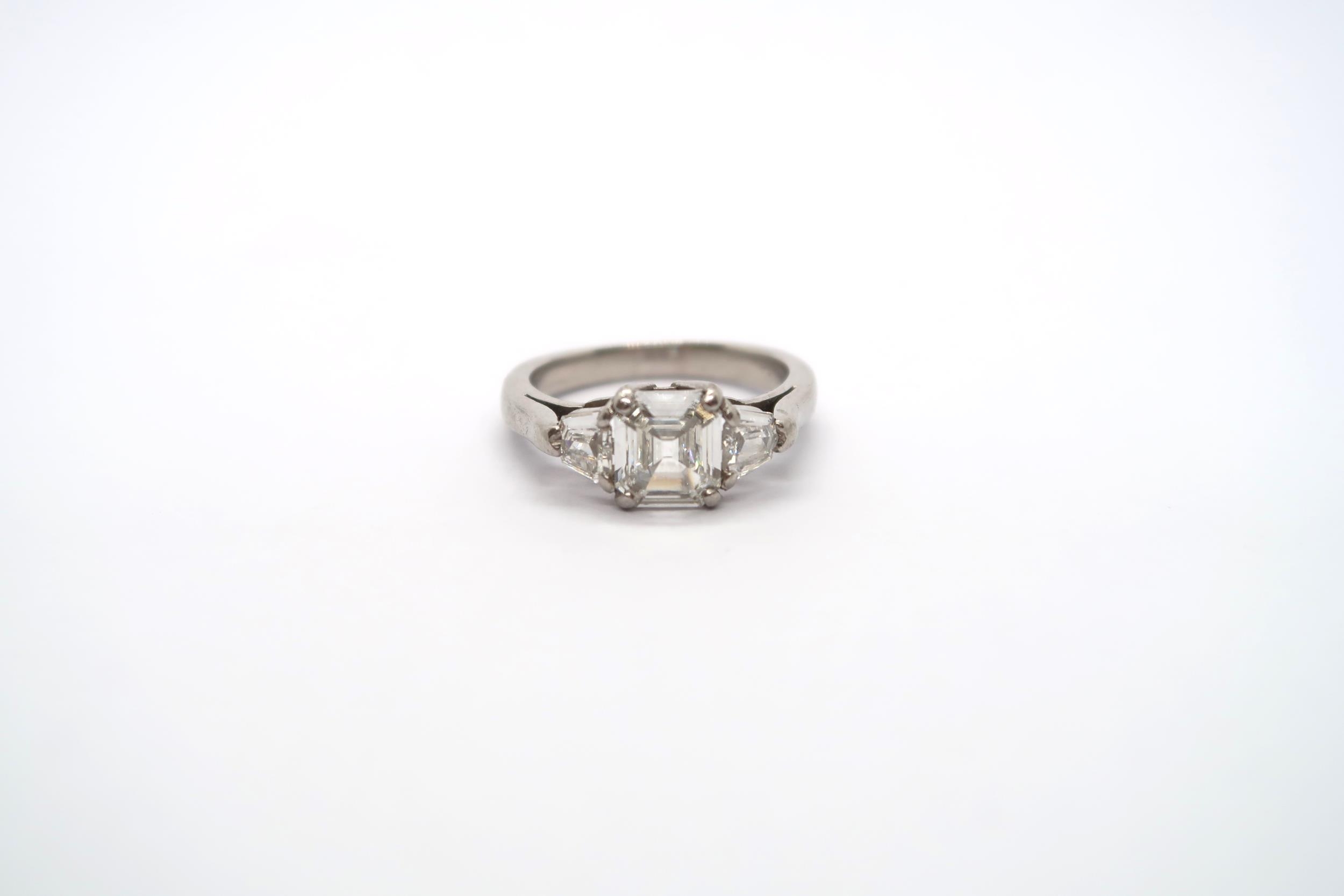 A very good platinum three stone diamond ring - The square emerald cut diamond estimated 1.1ct - Image 3 of 11