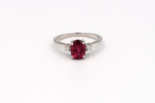 An 18ct white gold red tourmalline (rubellite) and diamond ring, rubellite is a very intense colour,