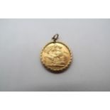 A George V Full Sovereign, Dated 1913, 8.97g with a 9ct yellow gold pendant mount.