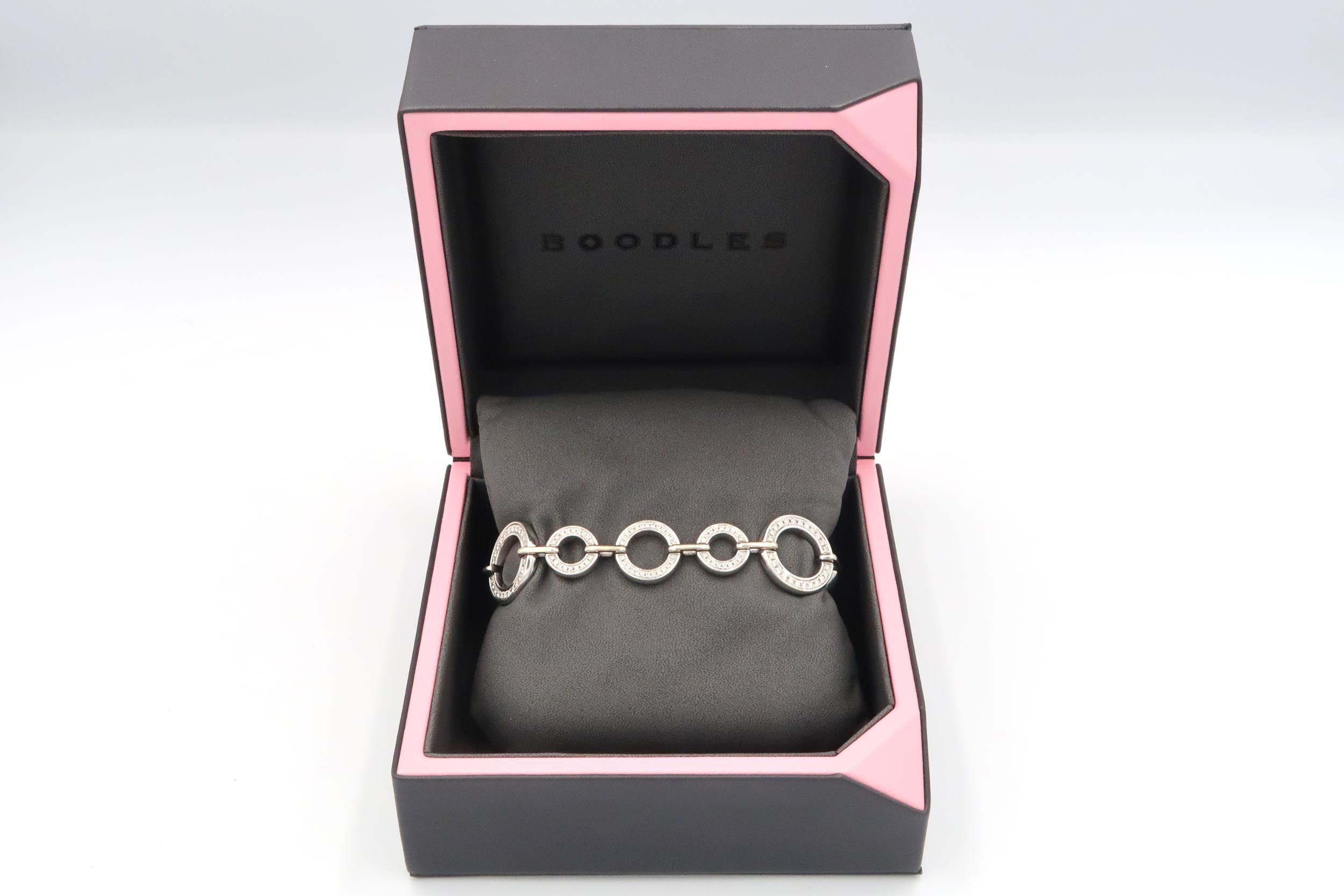 An 18ct white gold diamond set Boodles 'Roulette' bracelet, grain set with round brilliant cut - Image 6 of 6