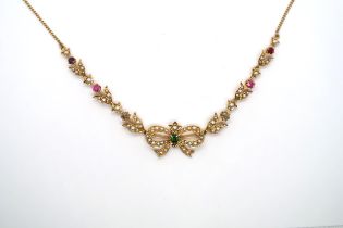 A seed pearl and gem set necklace, with central bow and foliate lines to the curb link chain. Gems