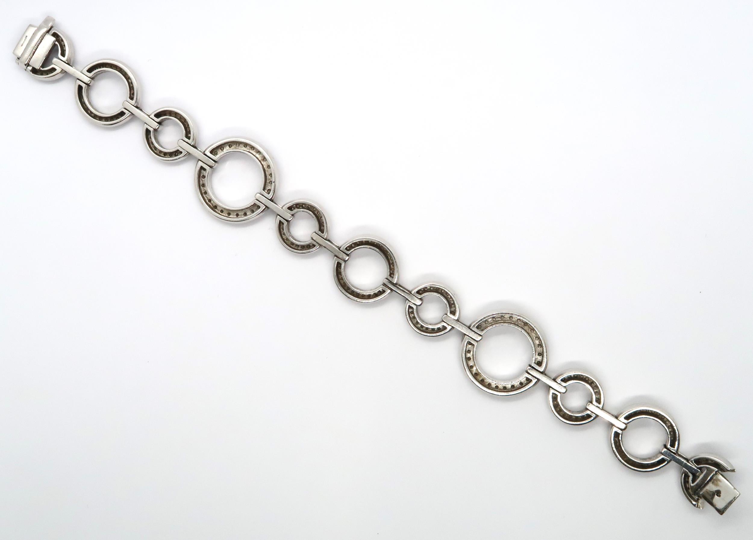 An 18ct white gold diamond set Boodles 'Roulette' bracelet, grain set with round brilliant cut - Image 3 of 6