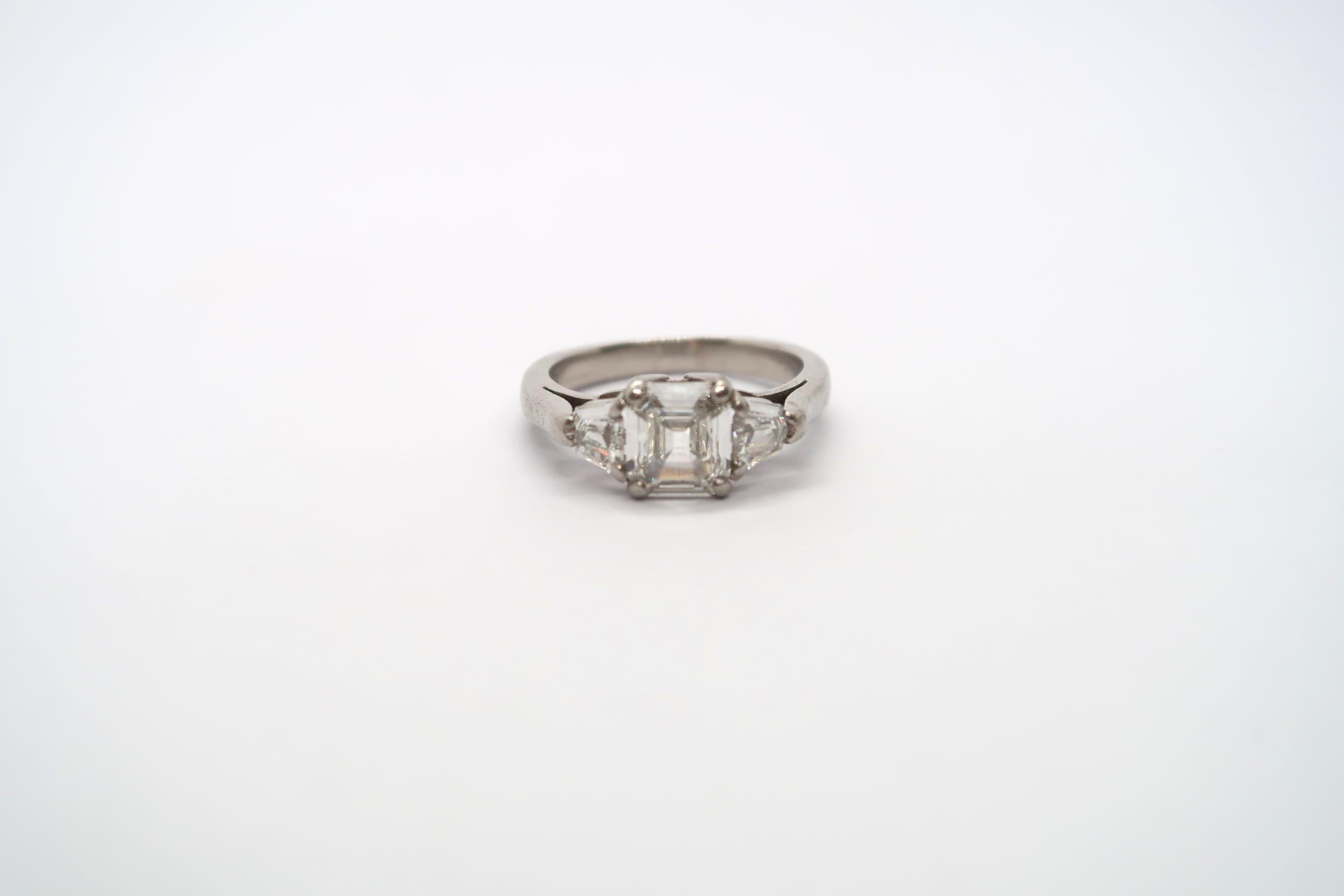 A very good platinum three stone diamond ring - The square emerald cut diamond estimated 1.1ct - Image 8 of 11