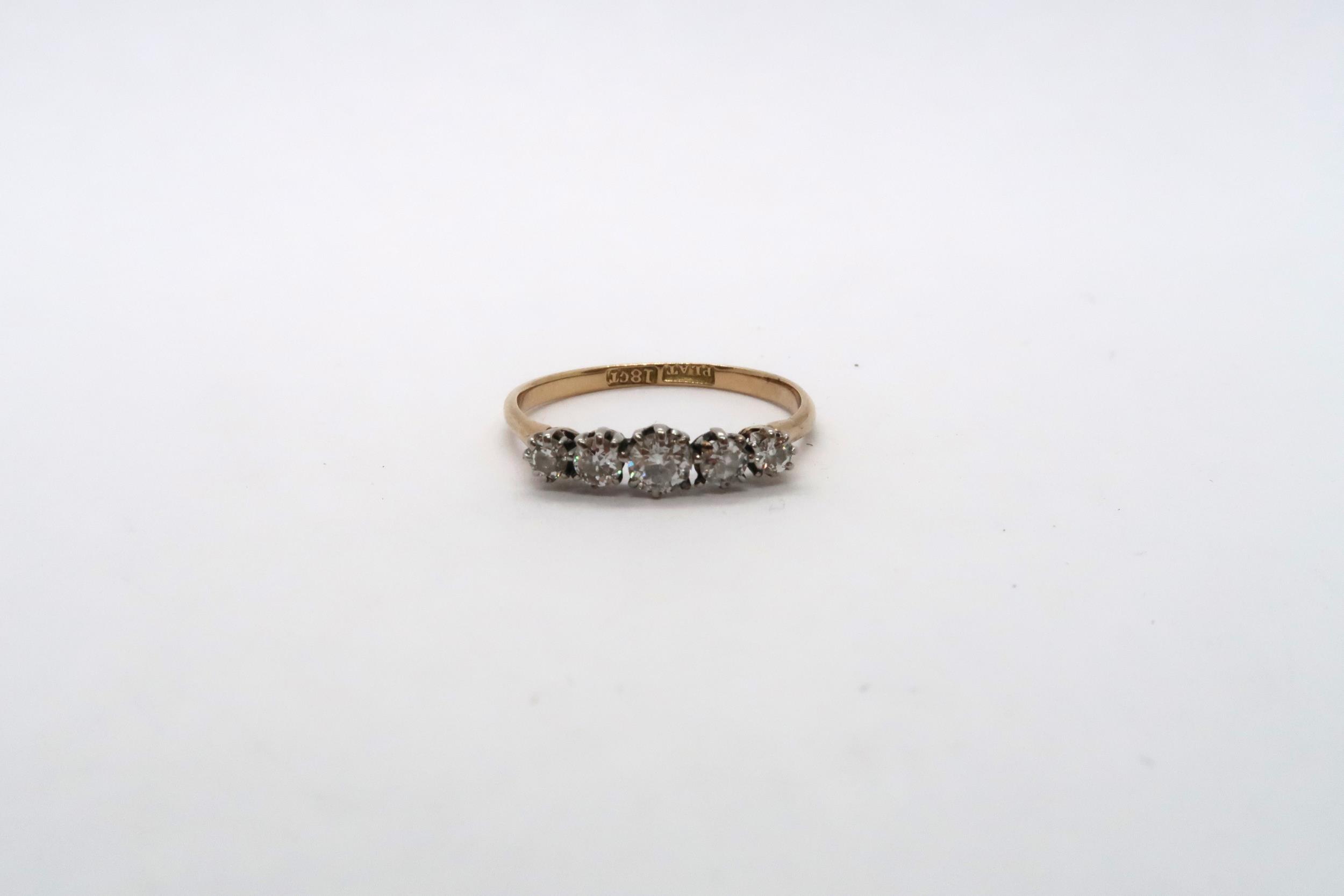 A five stone diamond ring - approx weight 1.89 grams - ring size P/Q