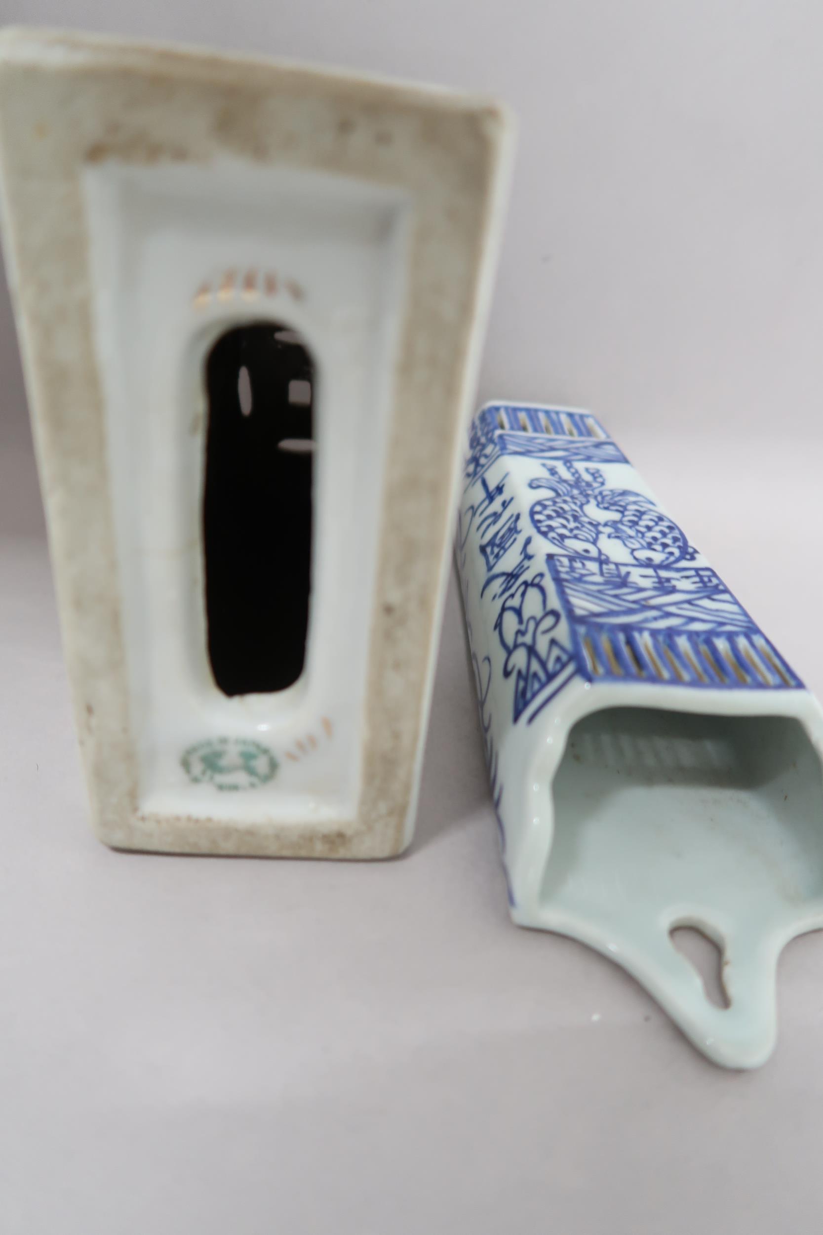 A Japanese porcelain incense holder, 13cm x 14cm high x 6cm, and a blue and white wall pocket - Image 2 of 3