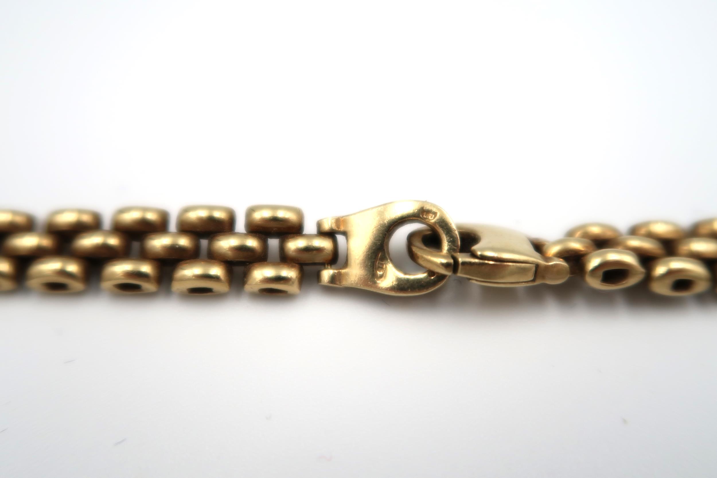 A 9ct gold three row necklet. Weight 37.95 grams. - Image 2 of 2