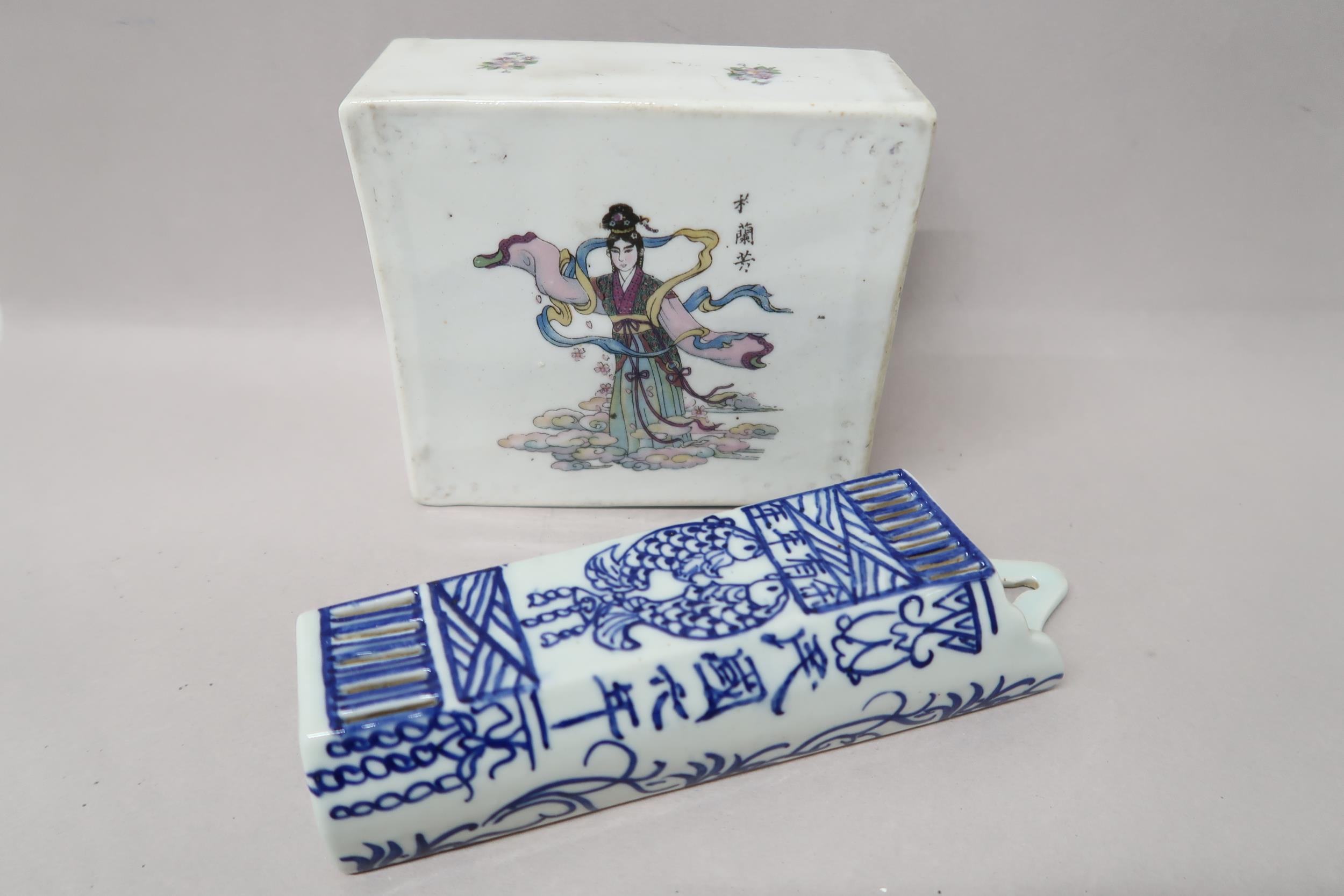 A Japanese porcelain incense holder, 13cm x 14cm high x 6cm, and a blue and white wall pocket