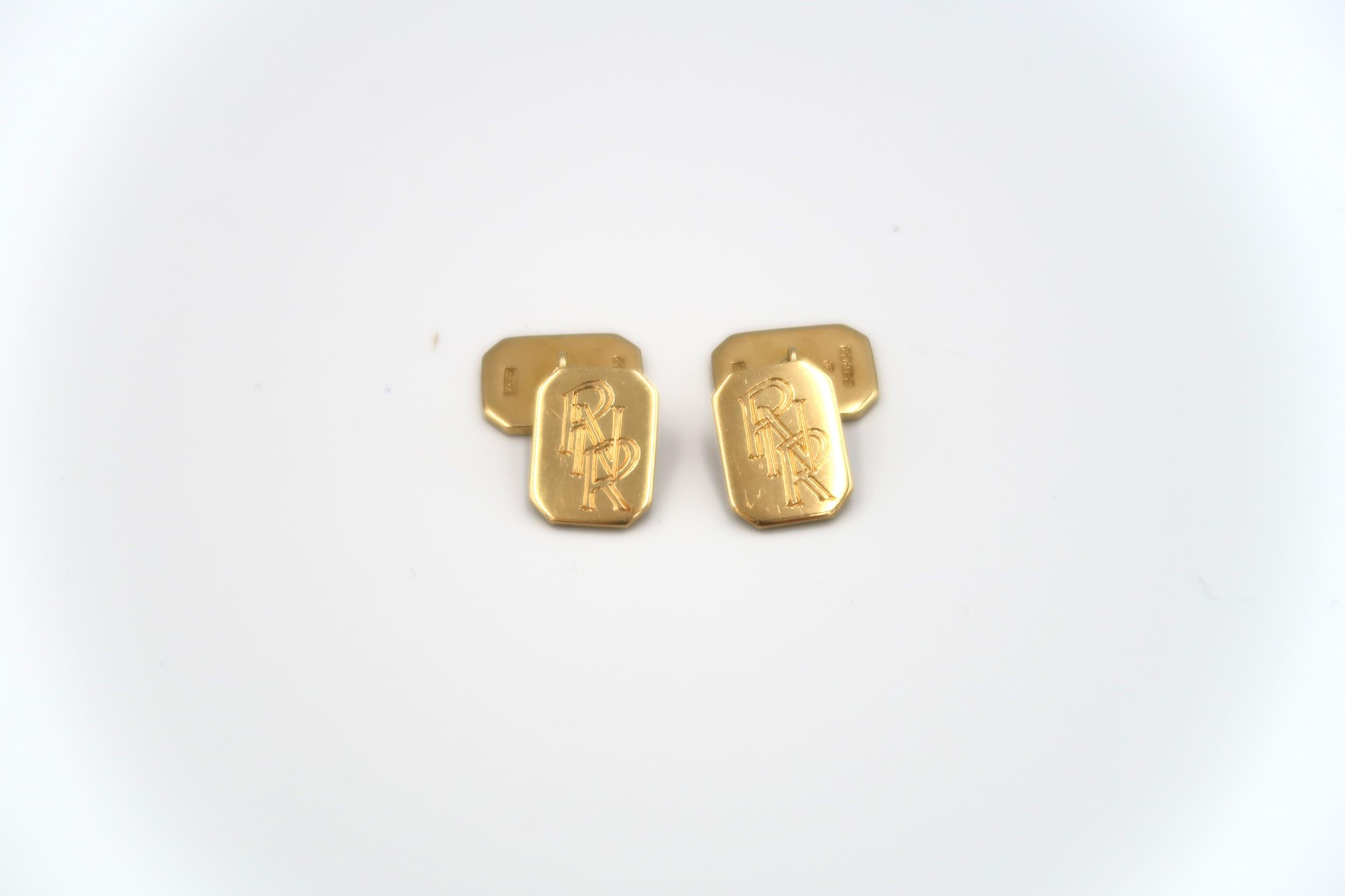 A pair of 18ct yellow gold cufflinks of rectangular form with canted corners, engraved PNR to