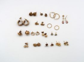 Sixteen pairs of 9ct gold earrings, total weight 14.5 grams