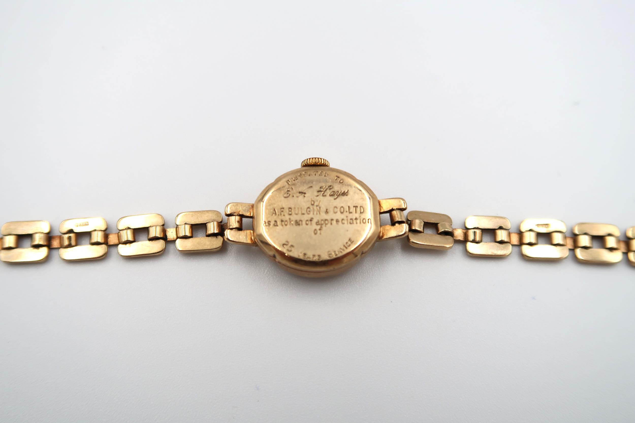 A ladies 9ct gold cased wristwatch on 9ct gold strap along with two 9ct gold watch cases. - Image 7 of 10