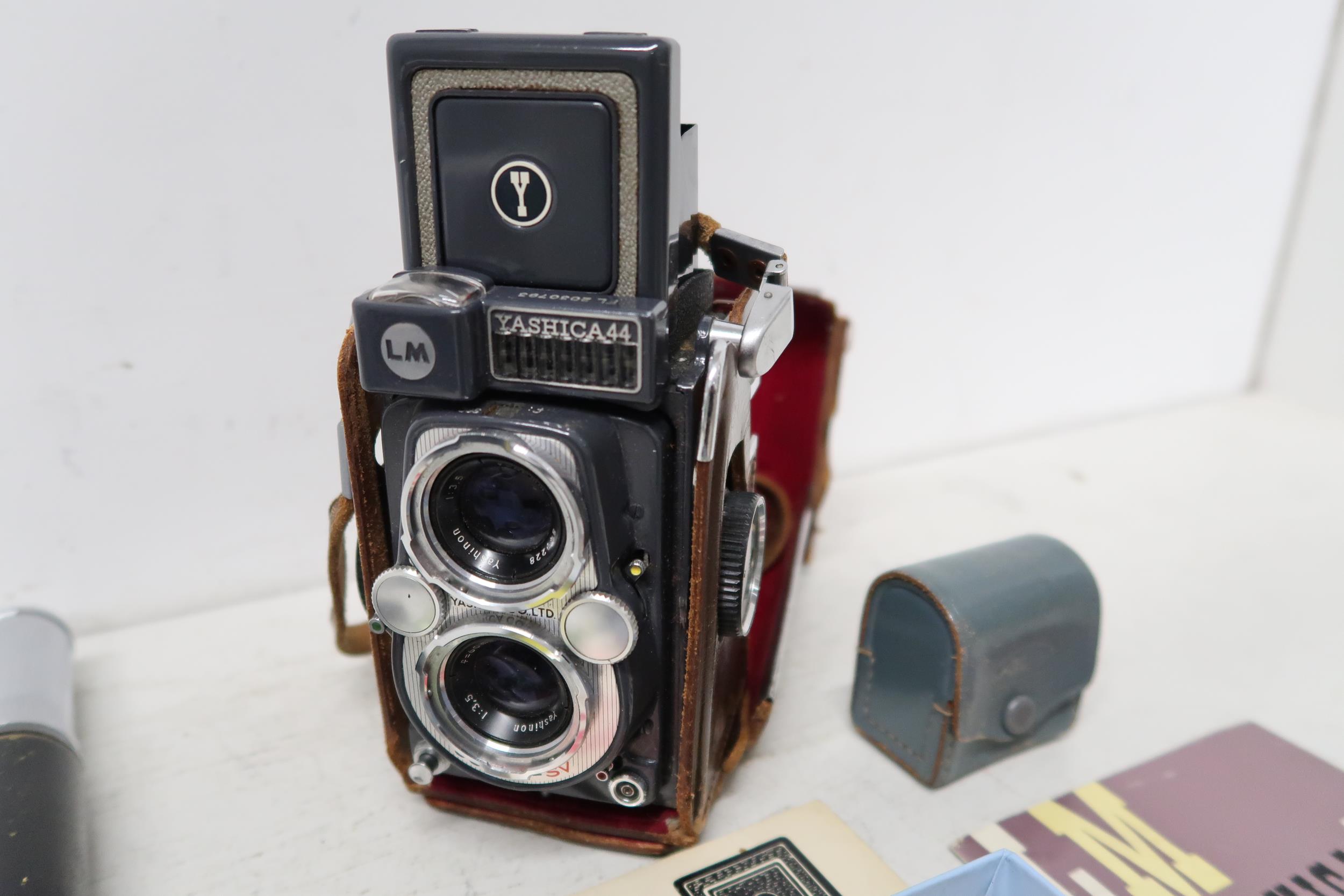 A Yashica 44 camera and assorted lens, booklets etc - Image 3 of 4