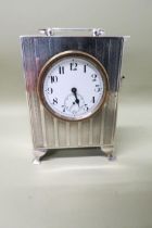 A solid silver cased clock - Birmingham 1938