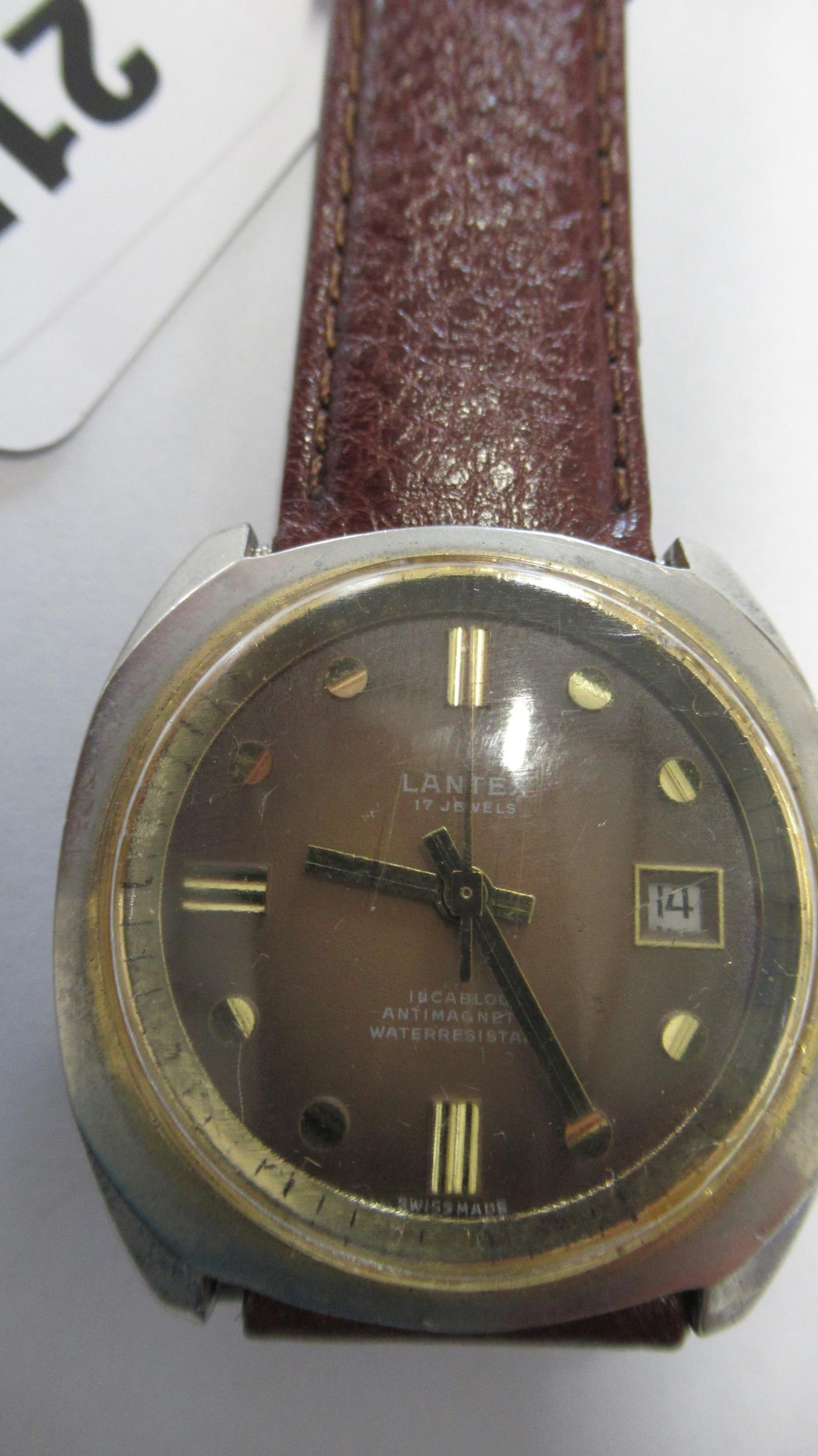 A gents Lantex auto with second hand and date on brown leather strap - working in the saleroom -