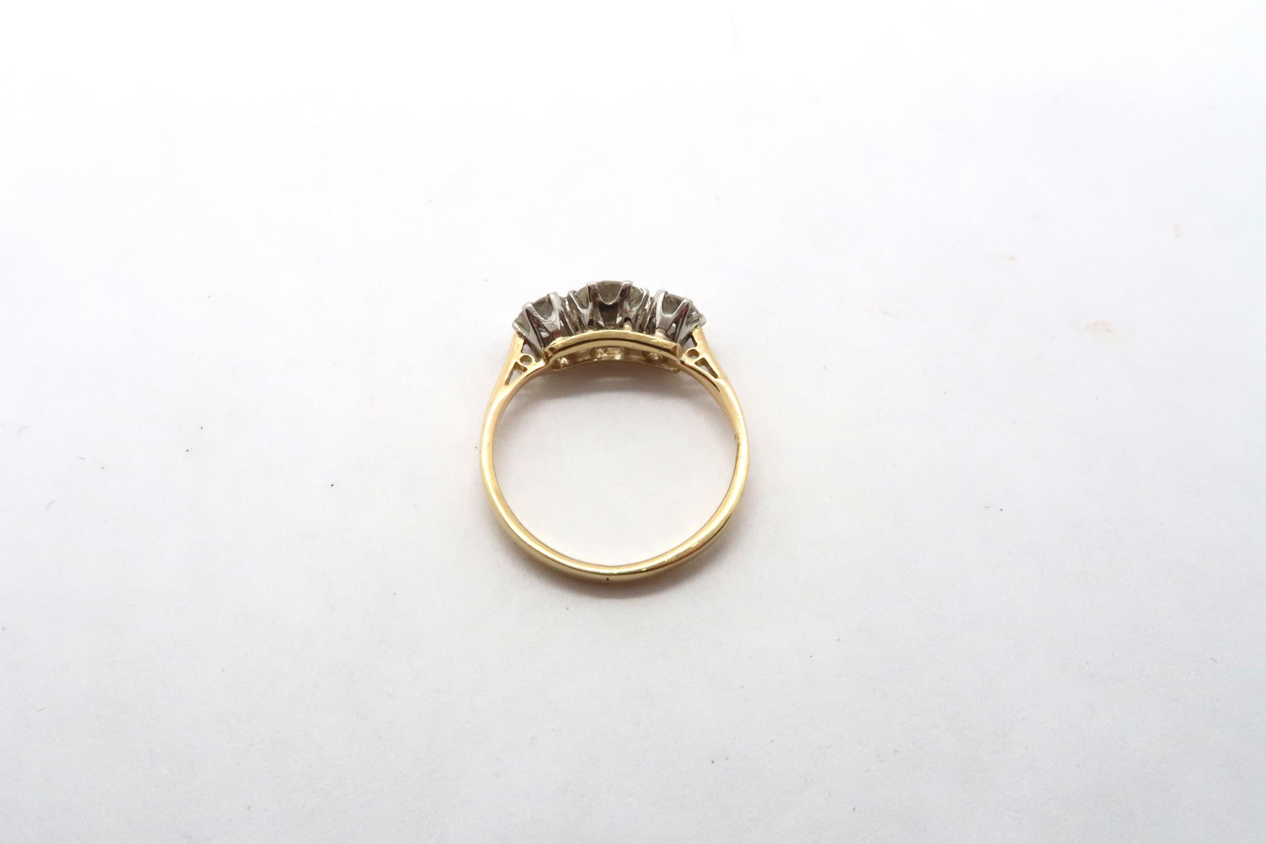 A three stone diamond and yellow metal ring, estimated I/J colour SI1- SI2 clarity, approx 0.75ct, - Image 3 of 3