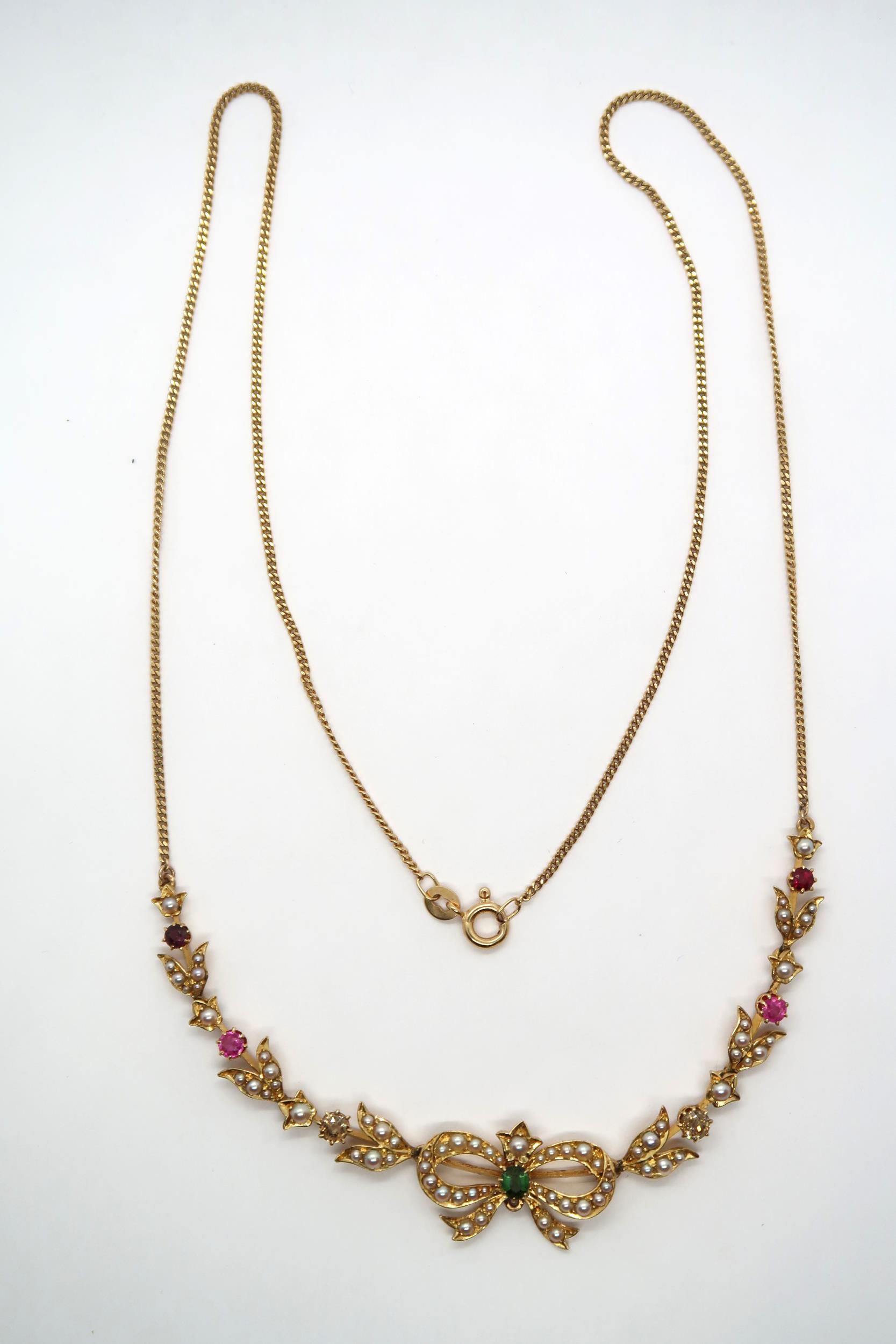 A seed pearl and gem set necklace, with central bow and foliate lines to the curb link chain. Gems - Image 2 of 6