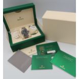 A Rolex Submariner watch, boxed with all paperwork, swing tag and original receipt dated 10/7/2020