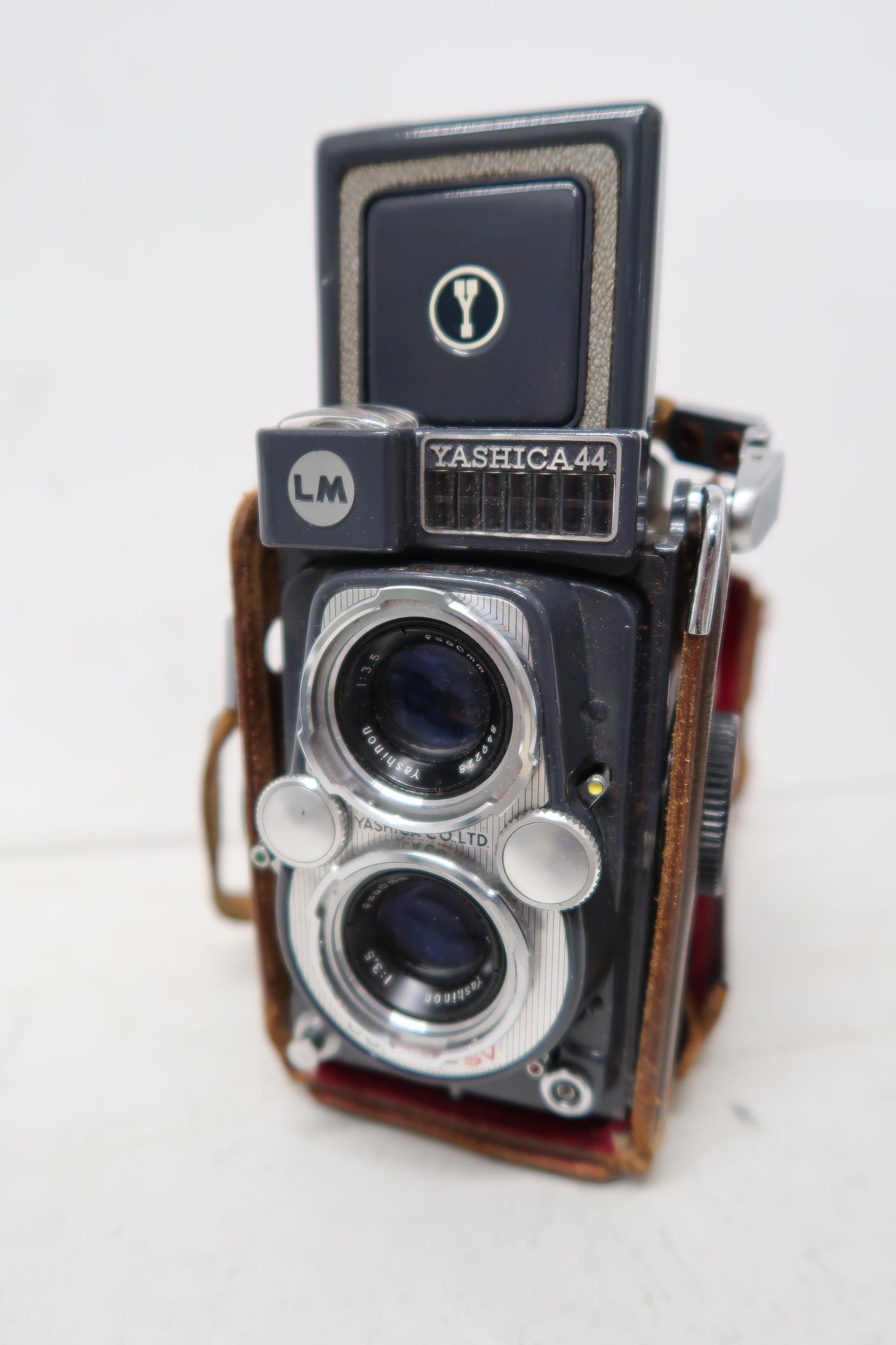 A Yashica 44 camera and assorted lens, booklets etc - Image 2 of 4