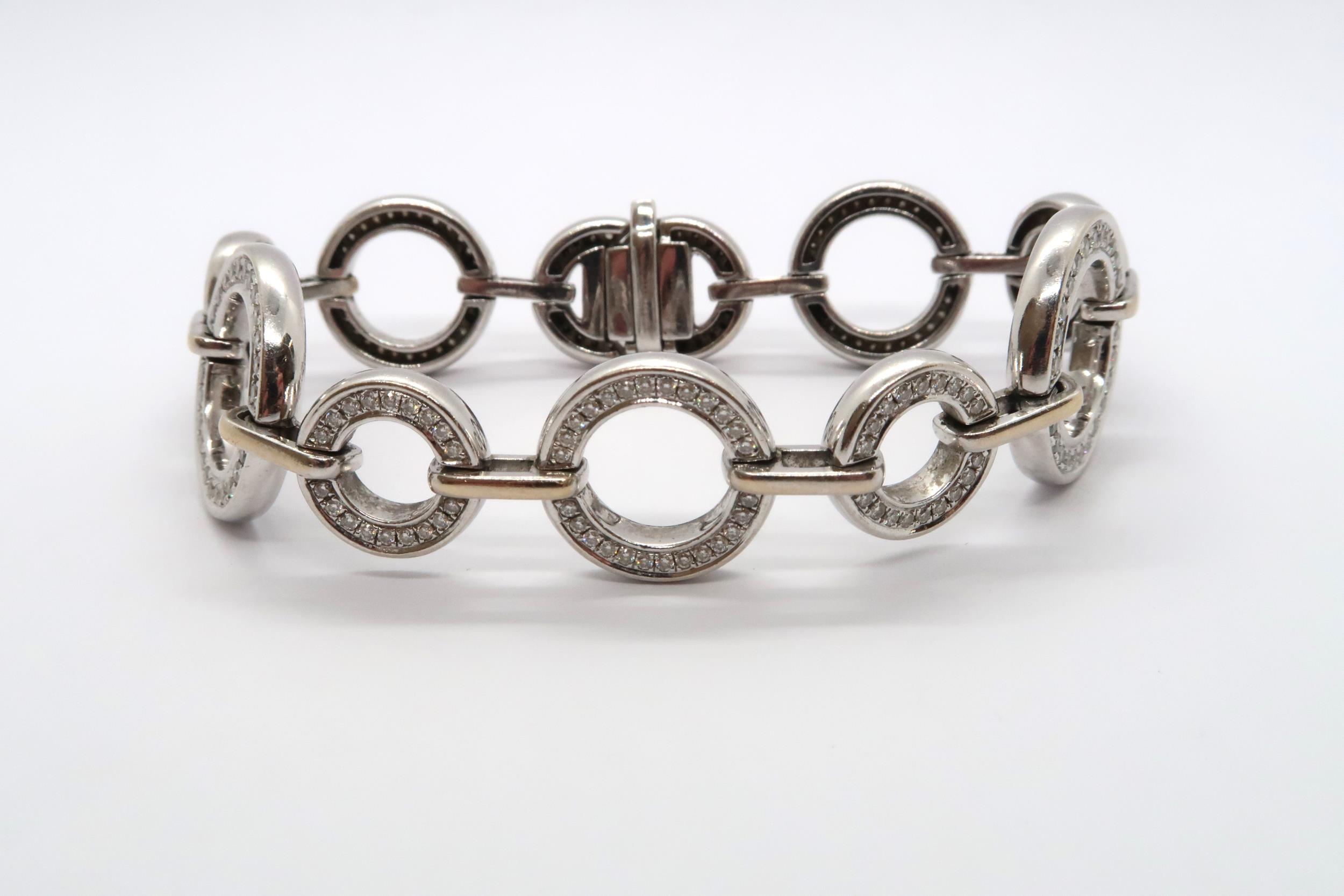 An 18ct white gold diamond set Boodles 'Roulette' bracelet, grain set with round brilliant cut - Image 4 of 6