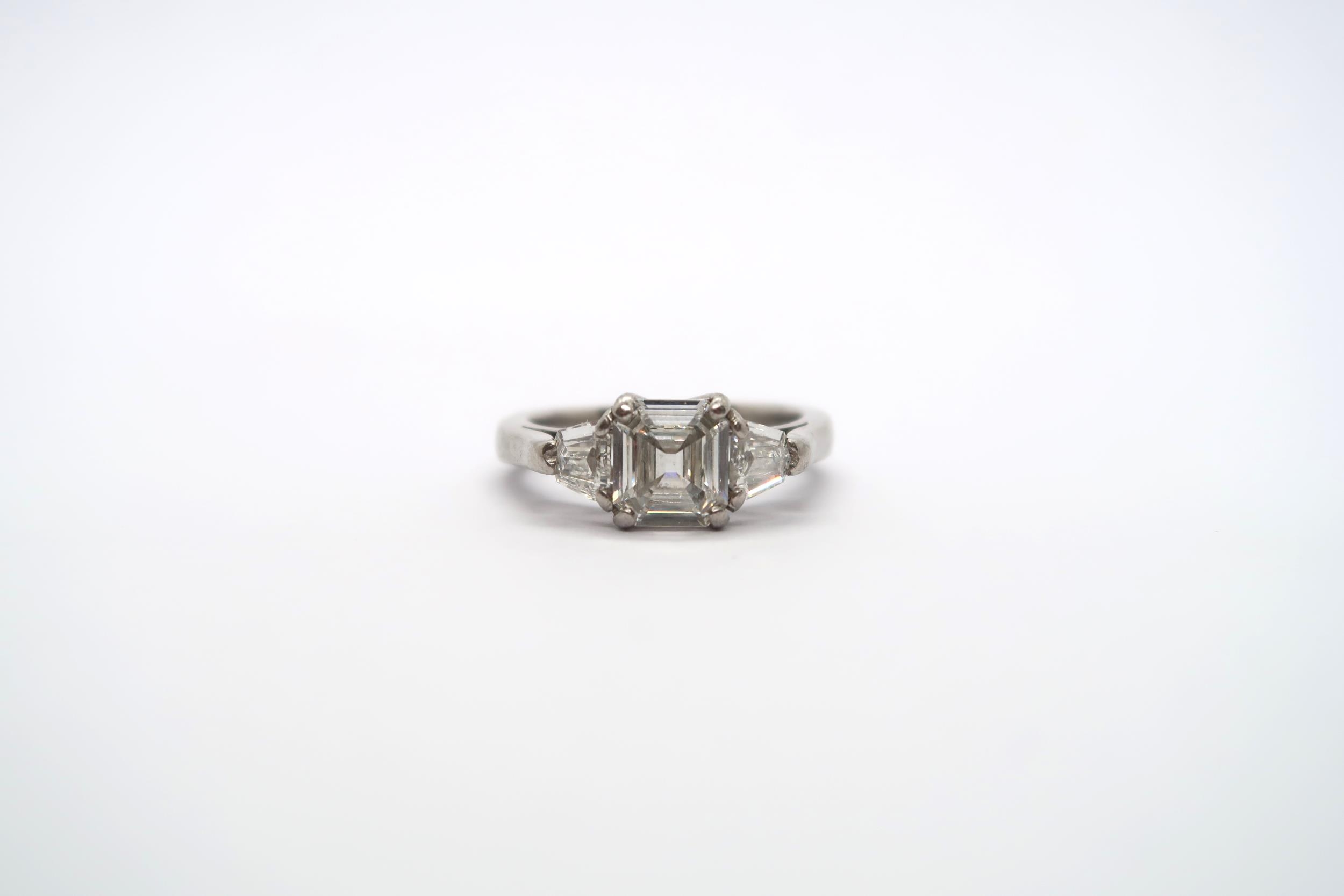 A very good platinum three stone diamond ring - The square emerald cut diamond estimated 1.1ct - Image 2 of 11
