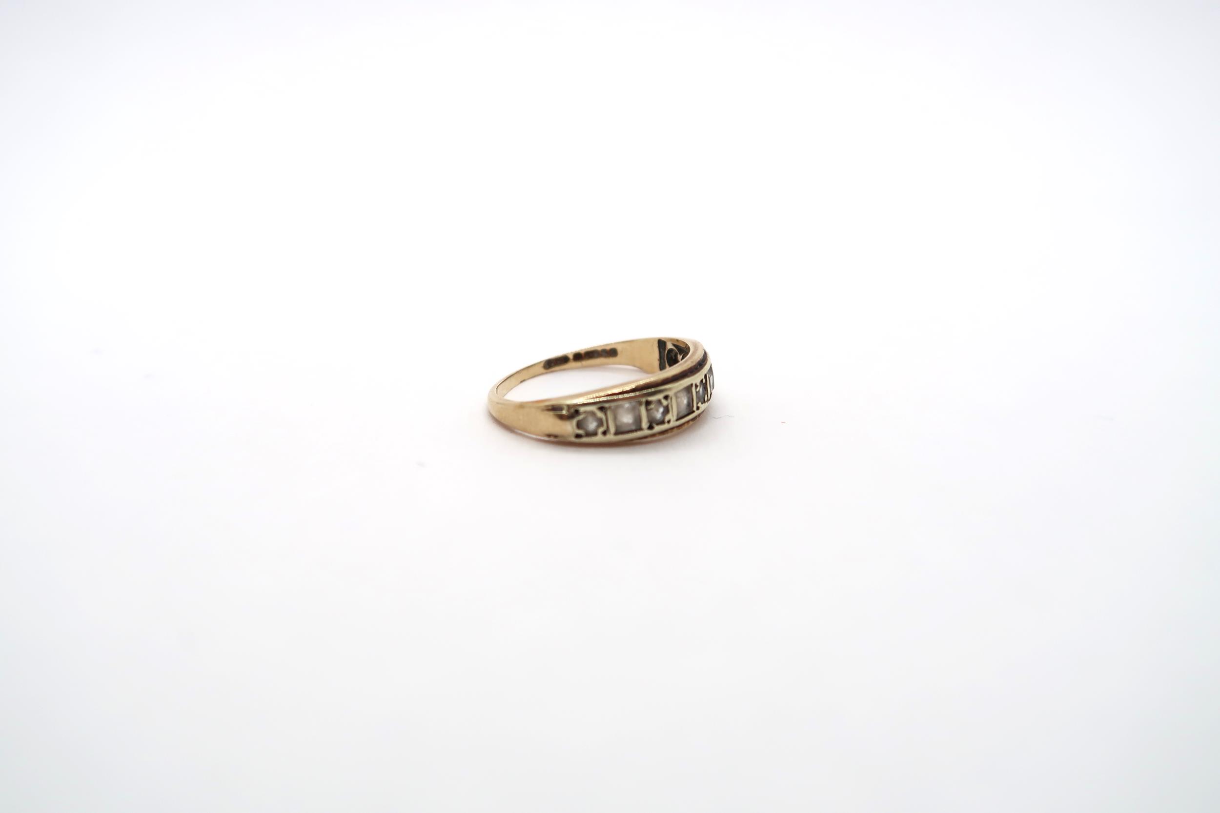 A 9ct yellow gold ring set with 9 white sapphires to shoulder, size J, approx 1.8 grams - Image 2 of 3