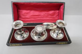 A pair of hallmarked candlesticks 1911 and Capstan inkwell and blotter