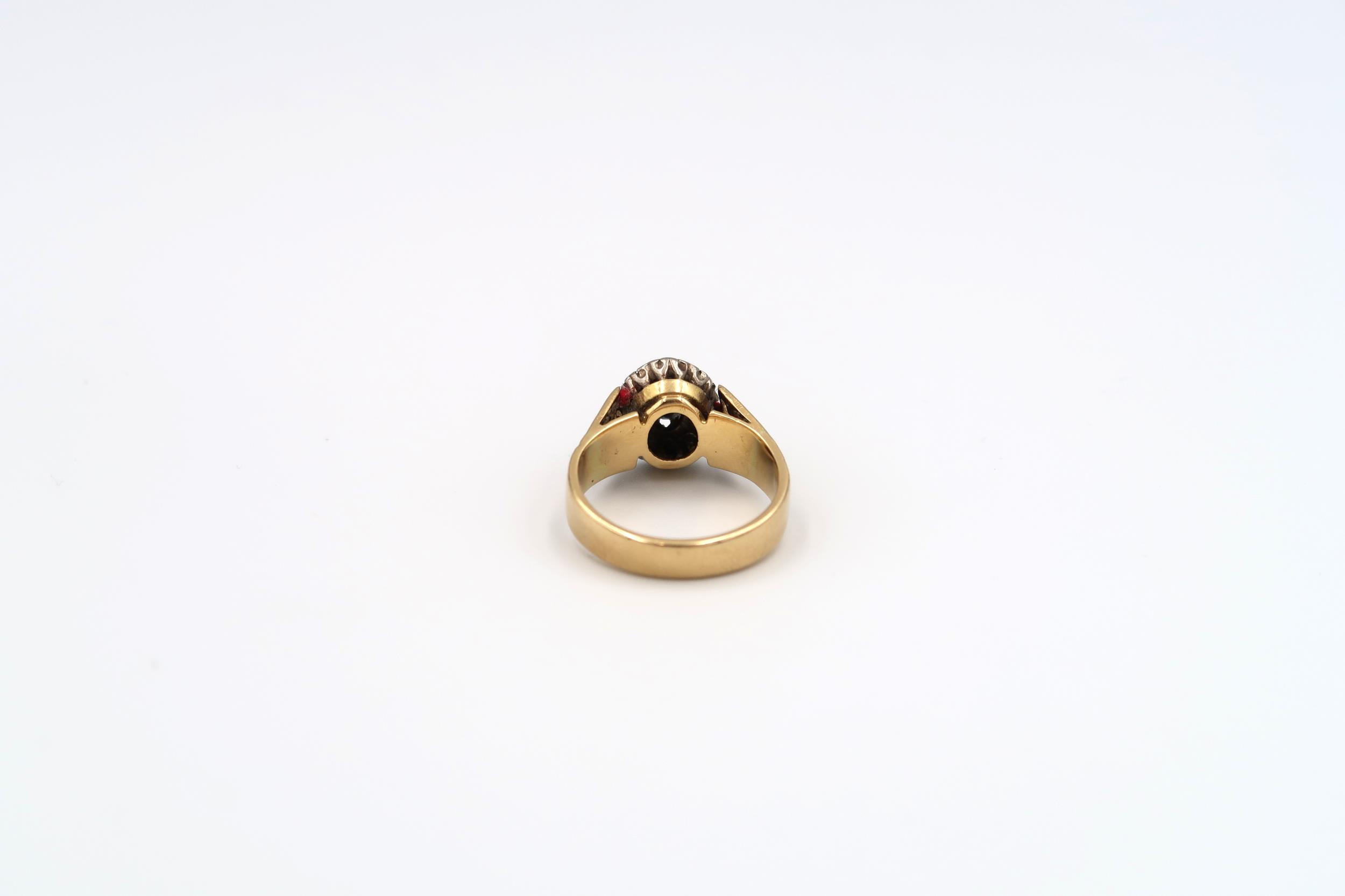 A Poss 18ct yellow and white gold dress ring with oval cut sapphire surrounded by 8 small old cut - Image 3 of 3