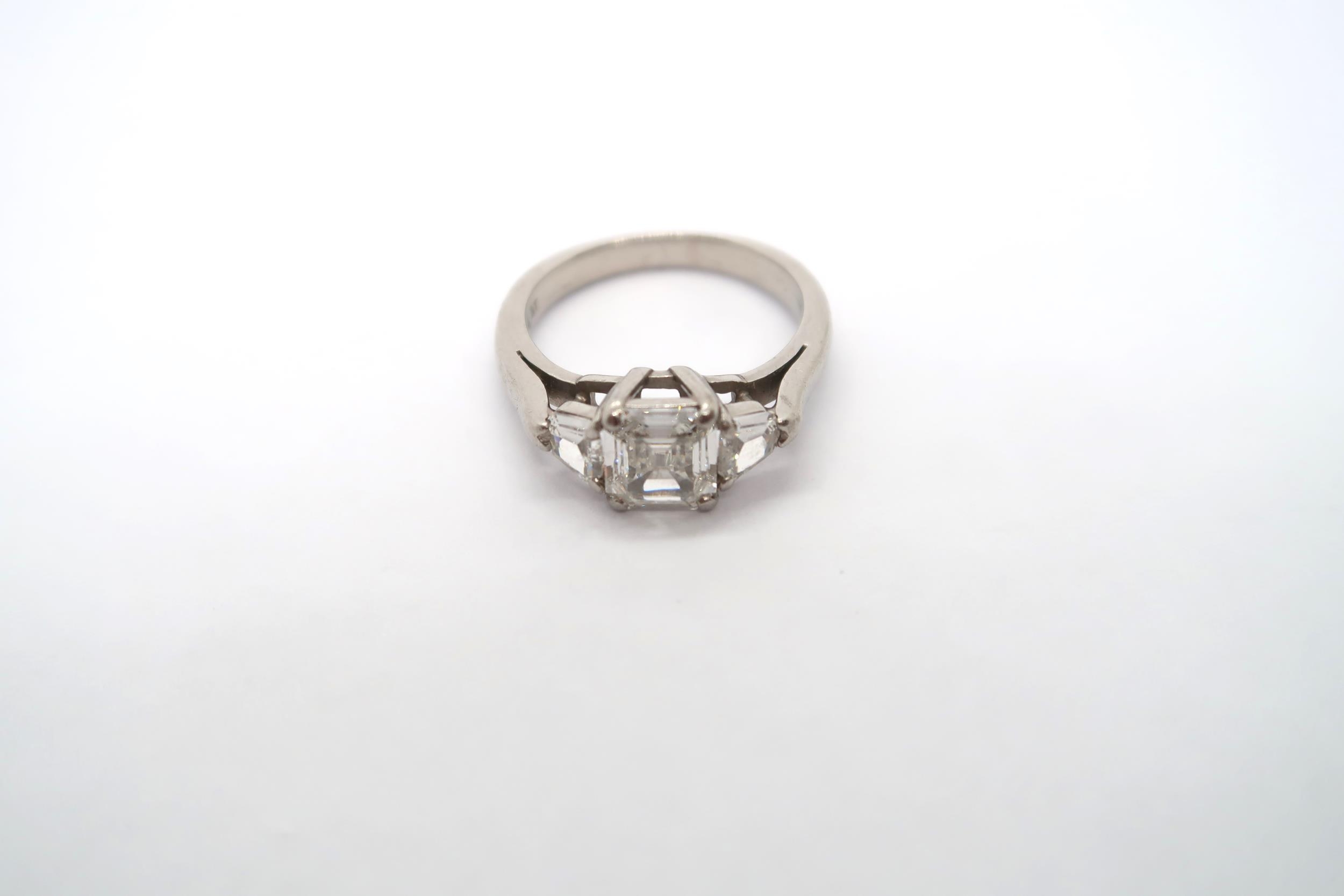 A very good platinum three stone diamond ring - The square emerald cut diamond estimated 1.1ct - Image 6 of 11