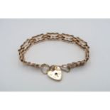 A 9ct gold articulated gold bracelet with heart lock - approx weight 7.5 grams