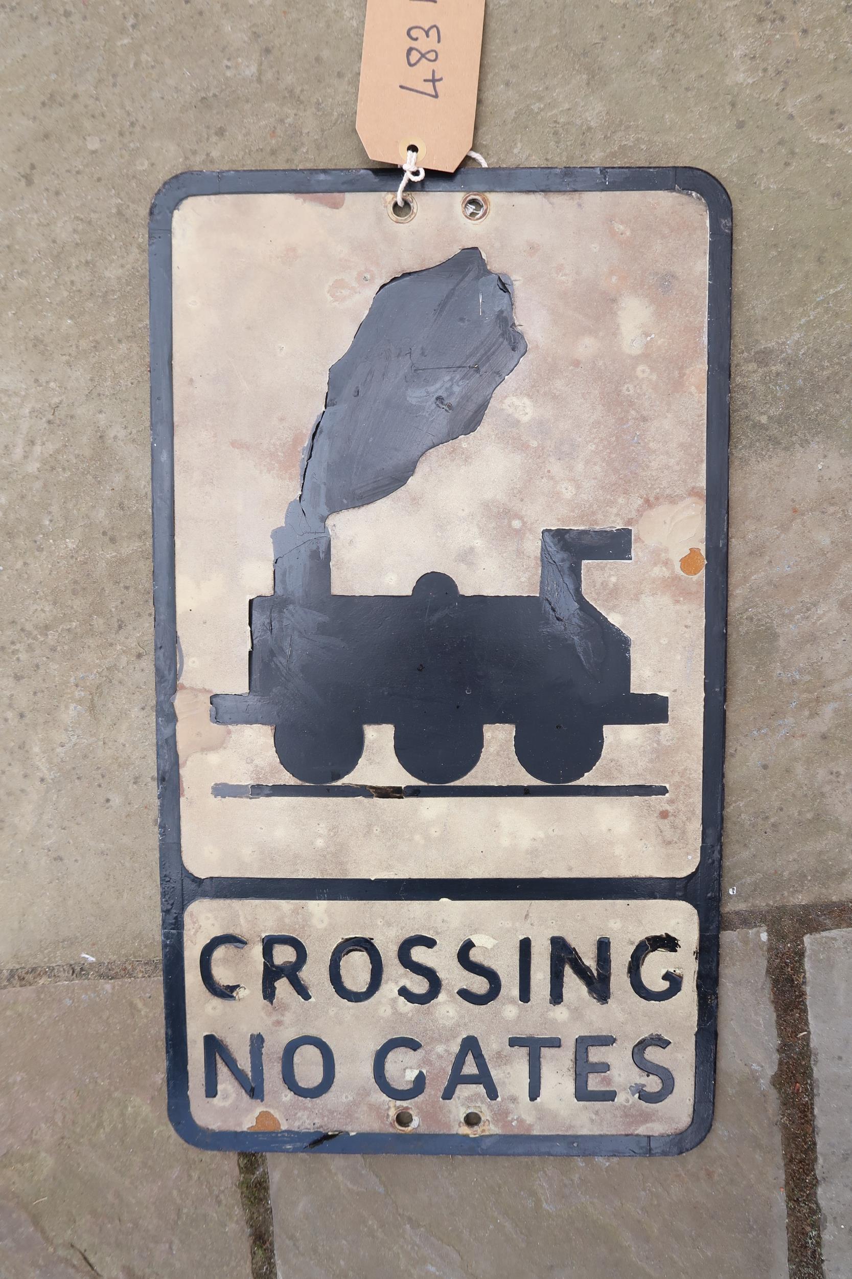 An original metal railway sign 'Crossing No Gates', in removed condition