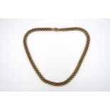 A 9ct gold three row necklet. Weight 37.95 grams.