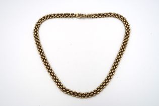 A 9ct gold three row necklet. Weight 37.95 grams.