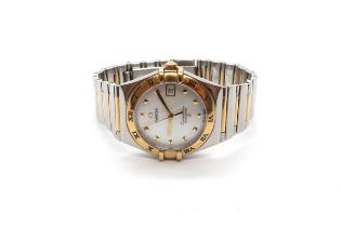 An Omega Constellation ladies watch with date aperture and baton markers on a bi colour stainless