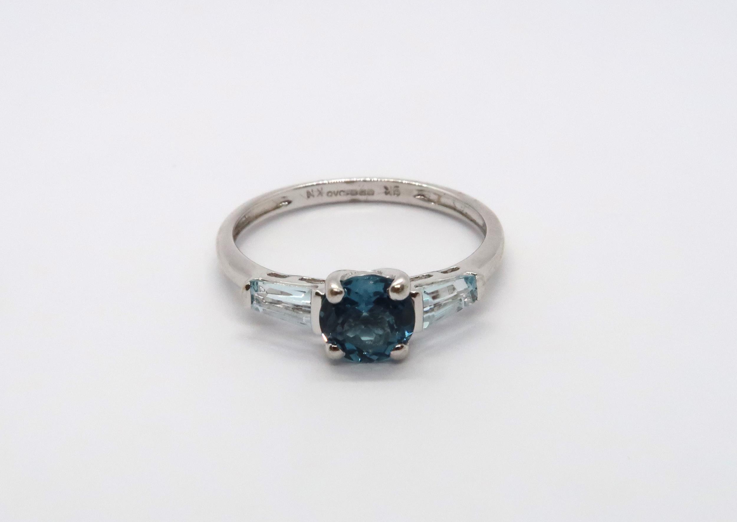 A 9ct white gold blue topaz and aquamarine ring, head size approx 15mm x 6mm, size O/P