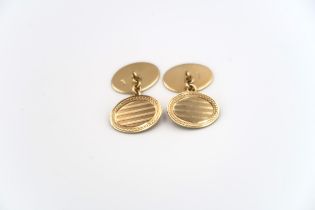 A pair of 9ct yellow gold cufflinks of oval form, engraved decoration, approx 11 grams