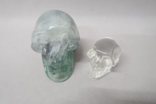 A crystal skull 8cm deep x 7cm high x 6cm wide, and one smaller