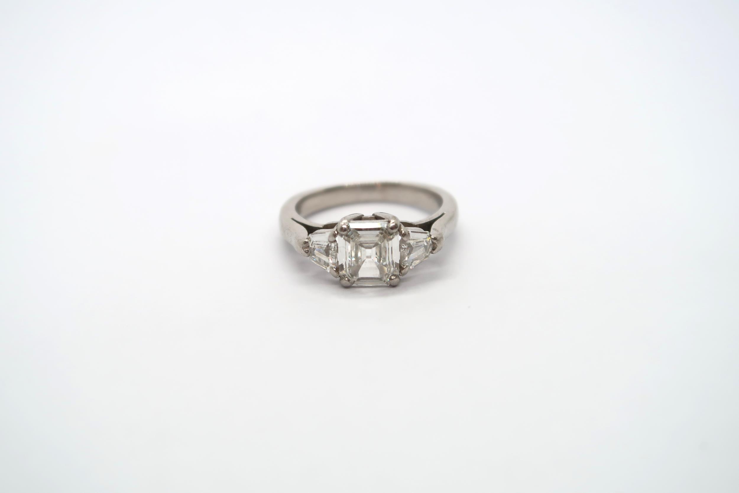 A very good platinum three stone diamond ring - The square emerald cut diamond estimated 1.1ct - Image 7 of 11